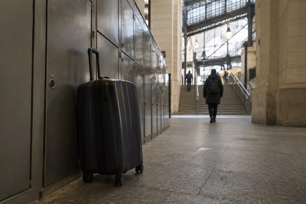 Rows of self-service lockers along a station corridor