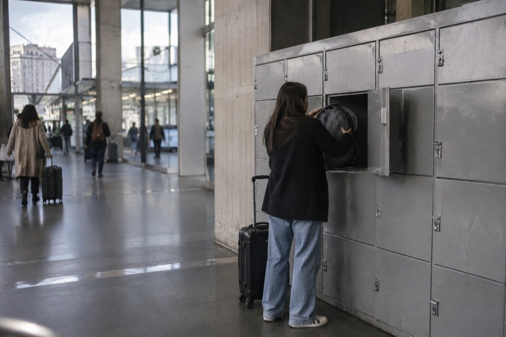 A row of self-service luggage lockers in a Paris train station