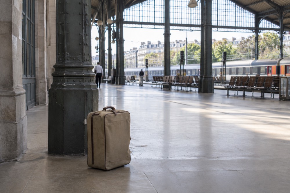 A suitcase left unattended on the floor of a Paris station hall