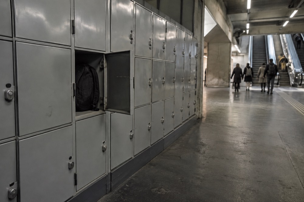 A row of self-service lockers in a station corridor